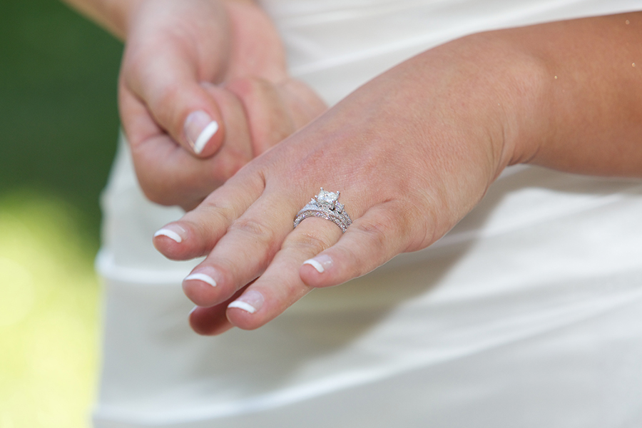 Bride admiring her wedding ring and band, bridal set - Breese, IL